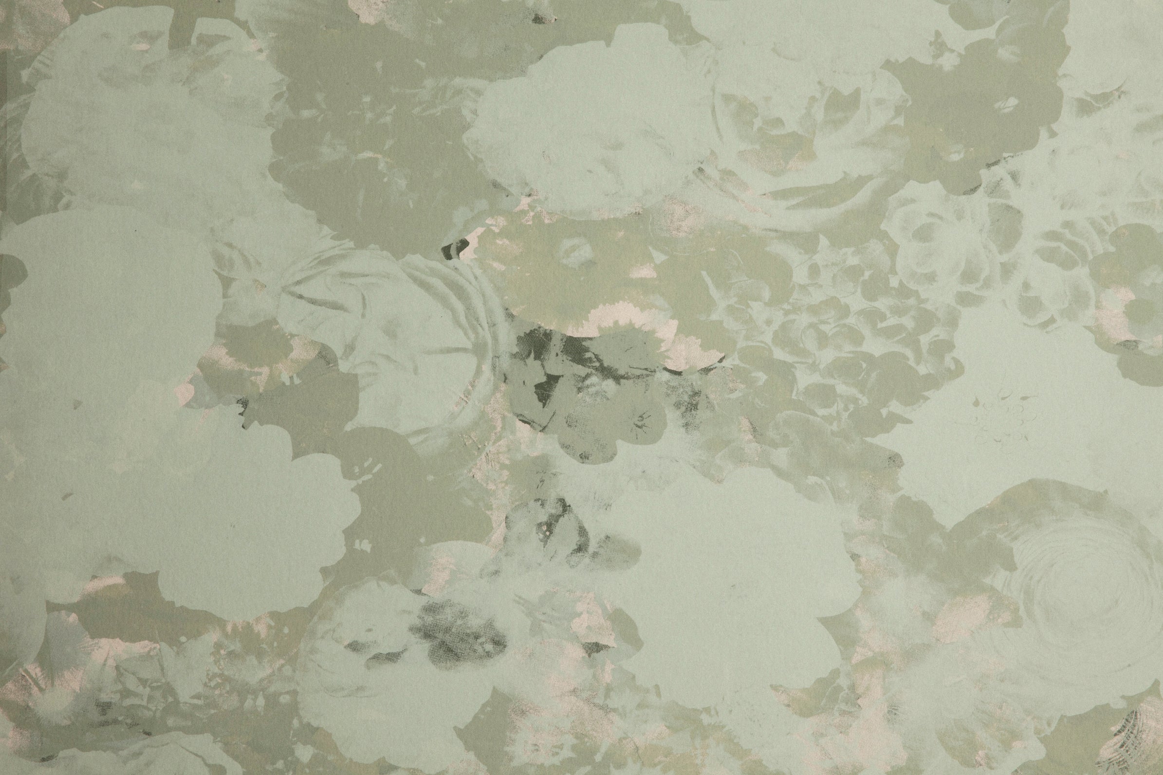 Detail of wallpaper in a dense photorealistic floral print in shades of gray and pastel green.