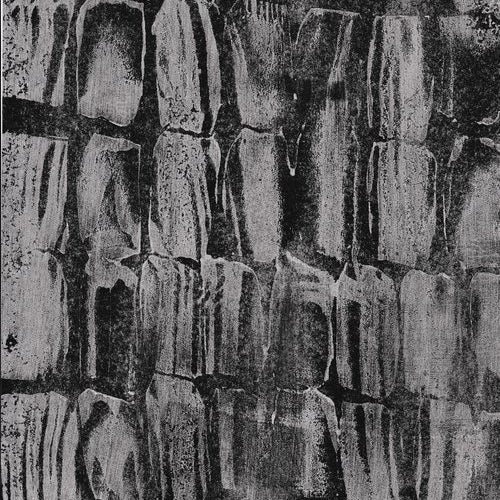 Detail of wallpaper in an abstract texutral print in shades of gray and black.