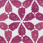 Fabric in a gridded floral print in cranberry on a white field.