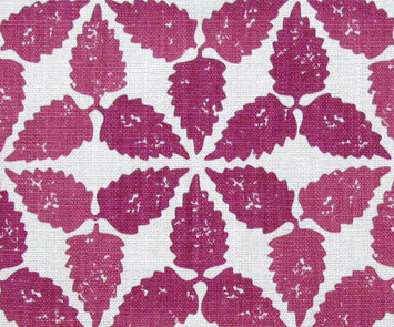 Fabric in a gridded floral print in cranberry on a white field.