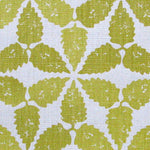 Fabric in a gridded floral print in mustard on a white field.