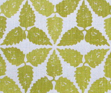 Fabric in a gridded floral print in mustard on a white field.