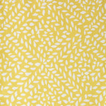 Detail of fabric in a botanical trellis print in white on a yellow field.