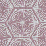 Fabric in a geometric lattice print in white on a light purple field.