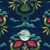 Detail of fabric in a playful snake, plant and moon print in jewel tones on a navy field.