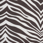 Detail of fabric in a zebra print in brown on a white field.