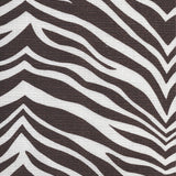 Detail of fabric in a zebra print in brown on a white field.