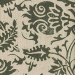 Detail of fabric in a floral damask print in green on a tan field.