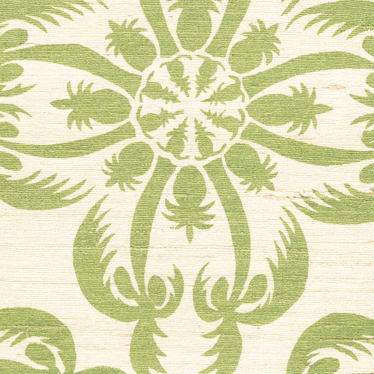 Detail of fabric in a playful botanical print in green on a cream field.