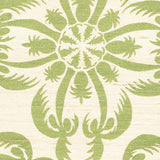 Detail of fabric in a playful botanical print in green on a cream field.