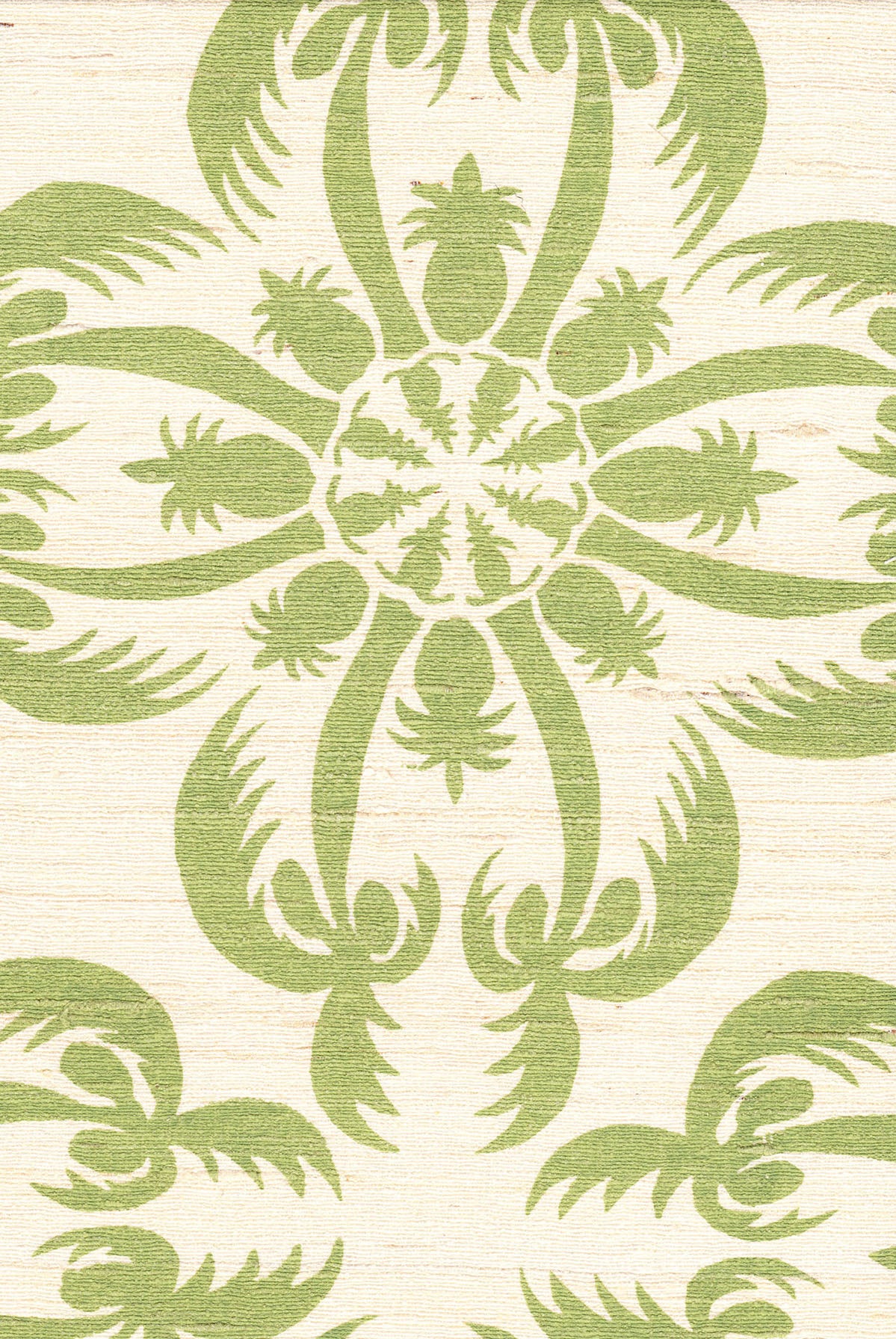 Detail of fabric in a playful botanical print in green on a cream field.