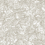 Detail of wallpaper in a painterly wave print in white on a tan field.