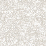 Detail of wallpaper in a painterly wave print in white on a cream field.