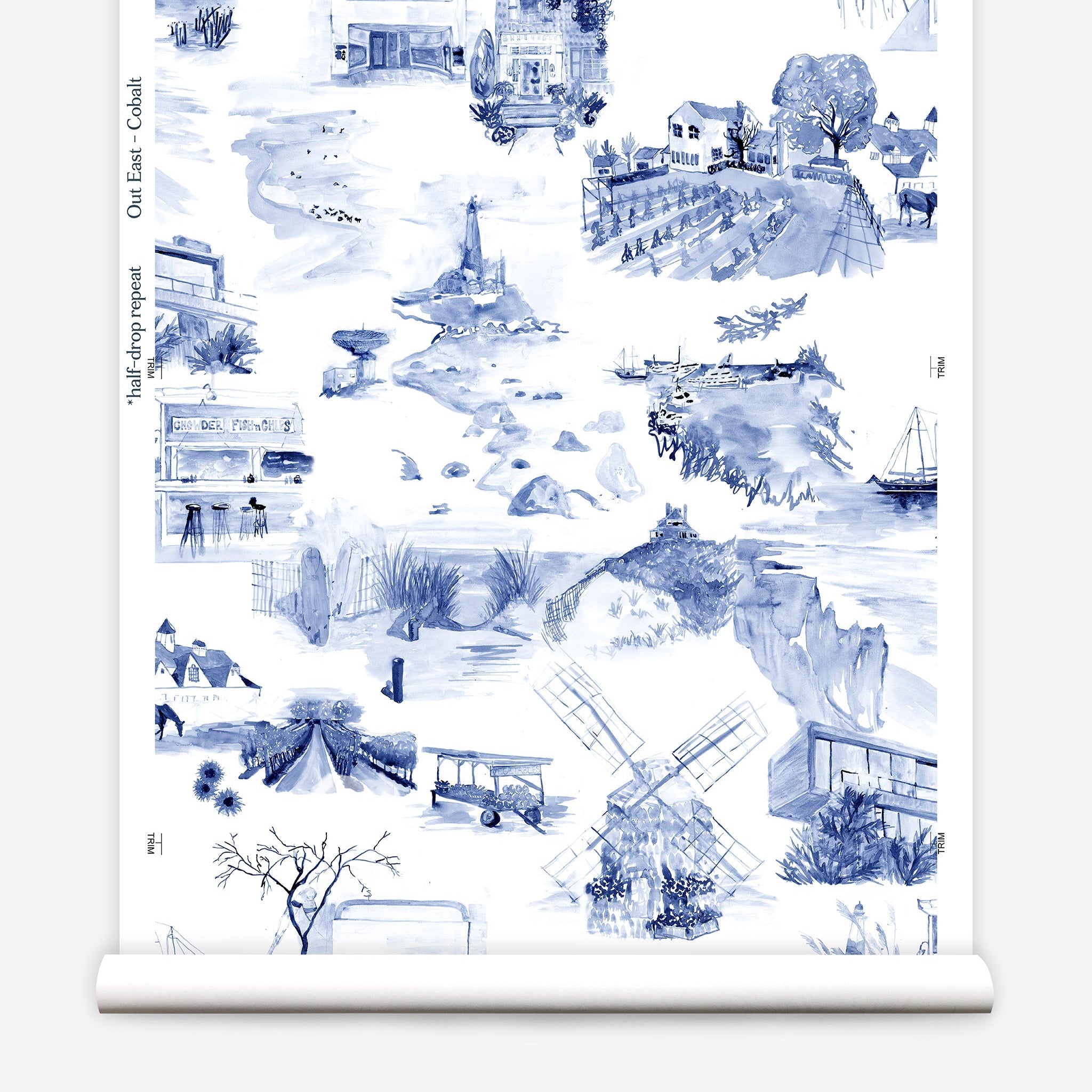 Partially unrolled wallpaper yardage in a playful illustrated city print in navy, blue and white.