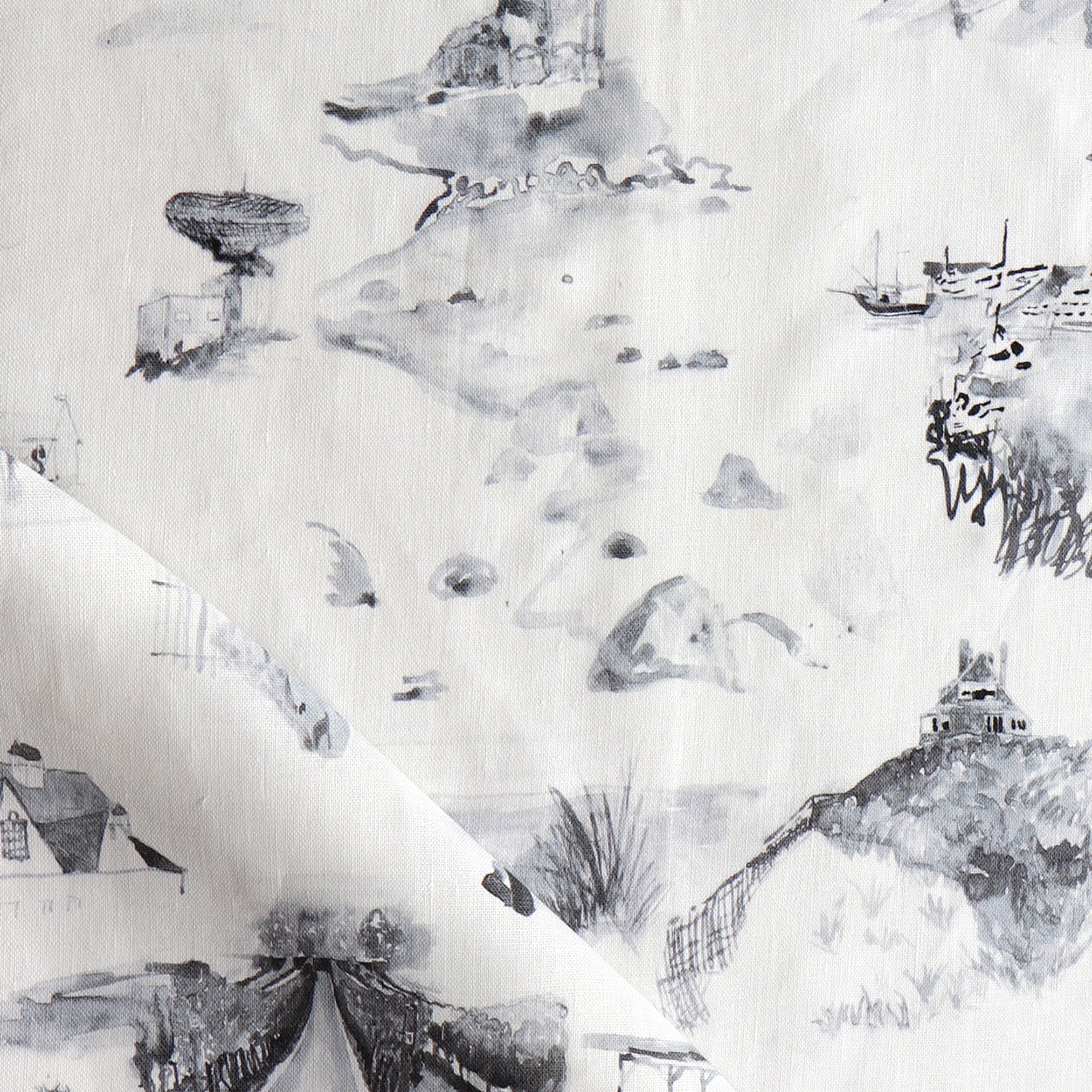 Draped fabric yardage in a playful painterly landscape print in gray on a cream field.