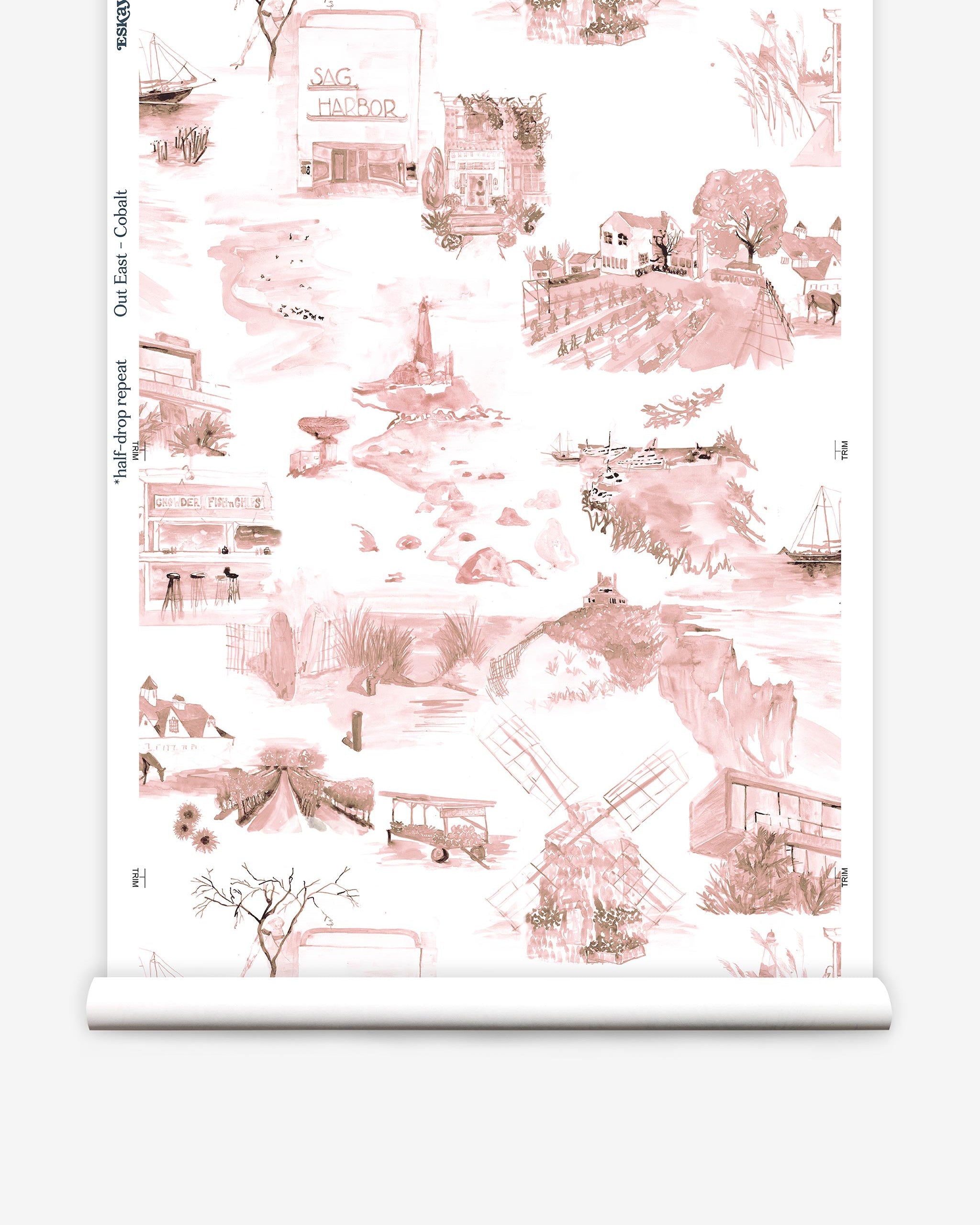 Partially unrolled wallpaper yardage in a playful illustrated city print in pink, brown and white.