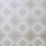 Detail of wallpaper in a diamond lattice print in shades of cream and grey.