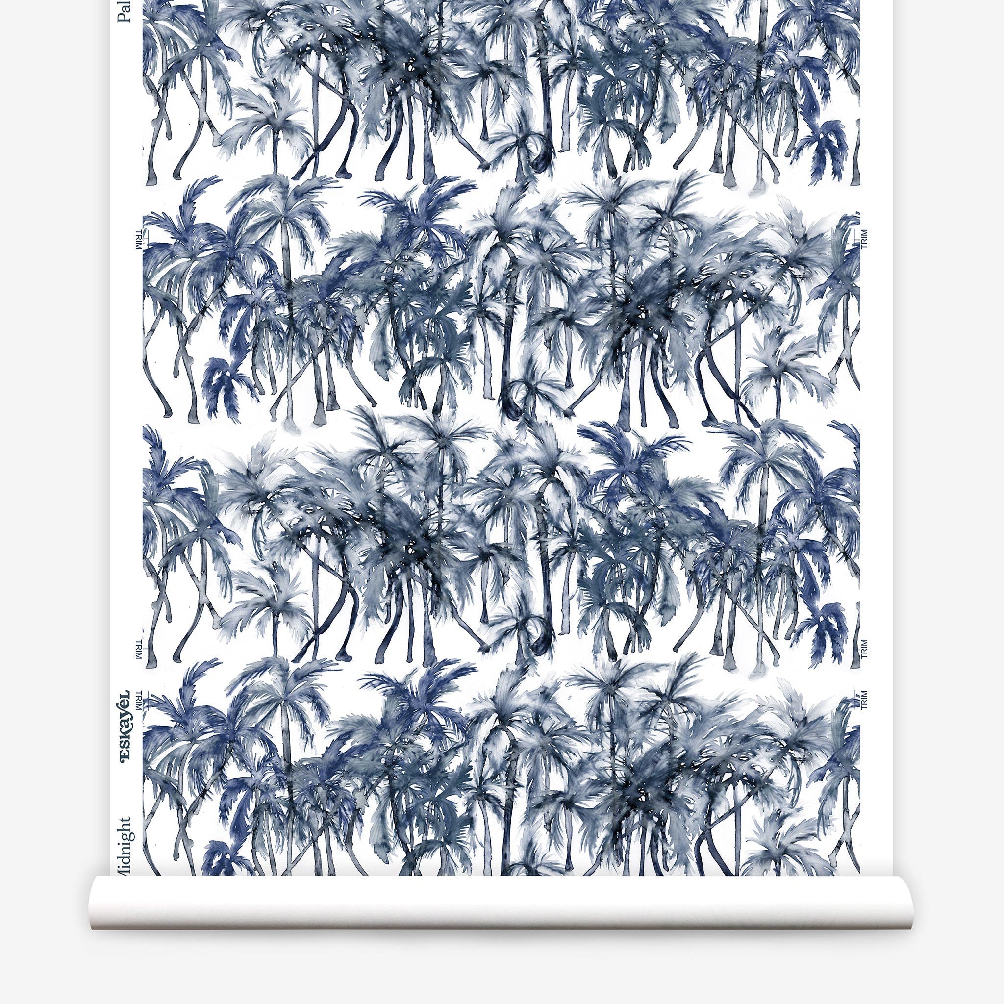 Partially unrolled wallpaper yardage in a painterly palm tree stripe print in navy, gray and white.