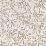 Detail of wallpaper in a playful palm tree and monkey print in tan on a cream field.