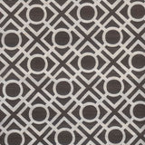 Detail of fabric in a geometric lattice print in dark brown on a white field.