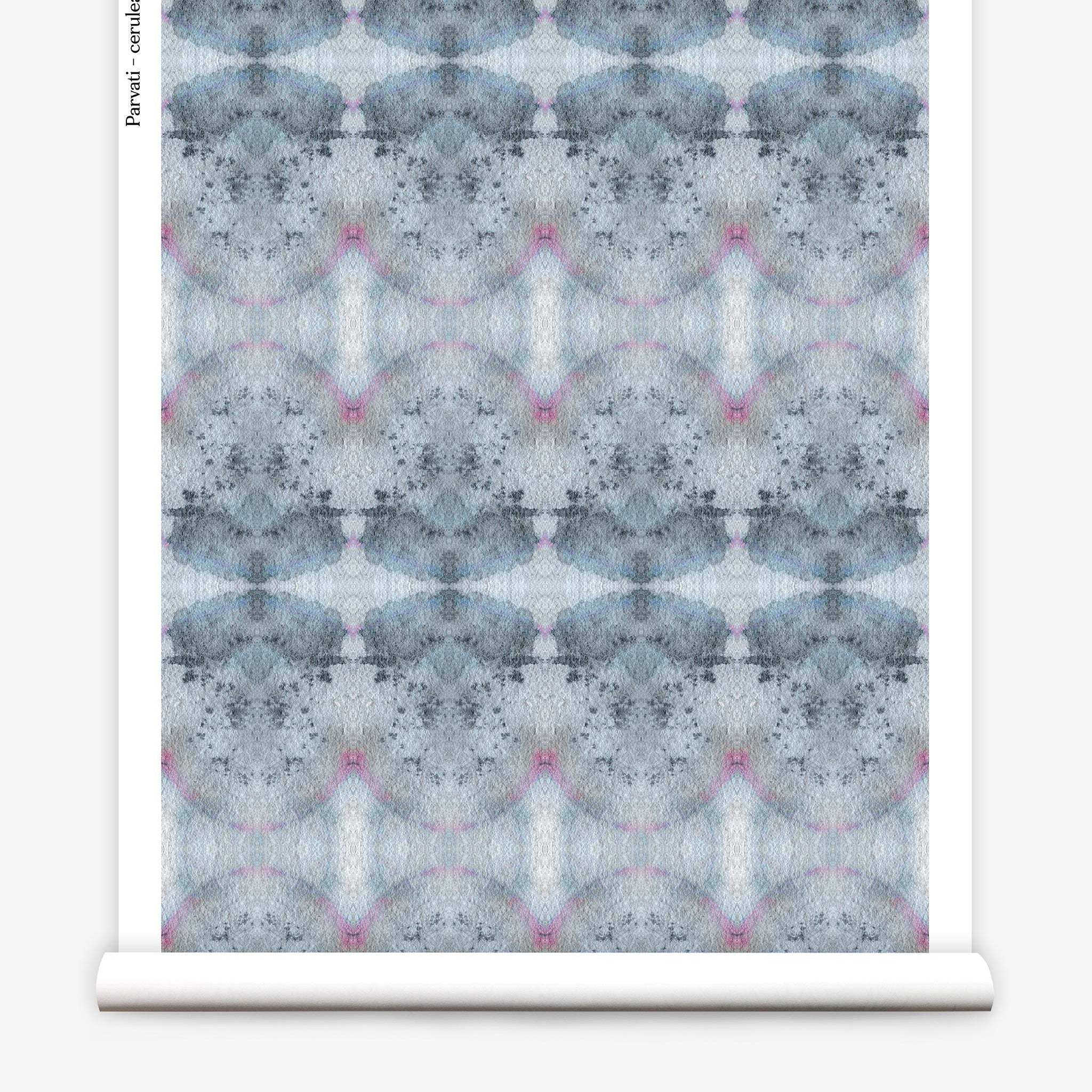 Partially unrolled wallpaper yardage in an abstract ink blot pattern in shades of gray, blue and pink.