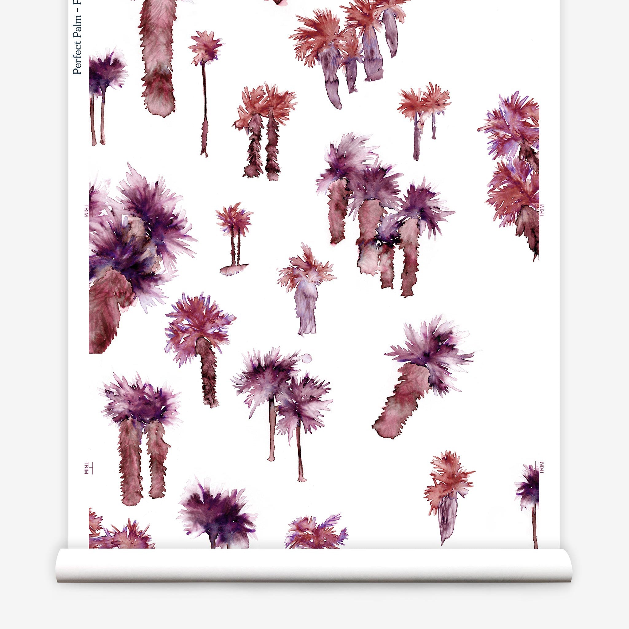 Partially unrolled wallpaper yardage in a playful palm tree print in shades of purple and red on a white field.