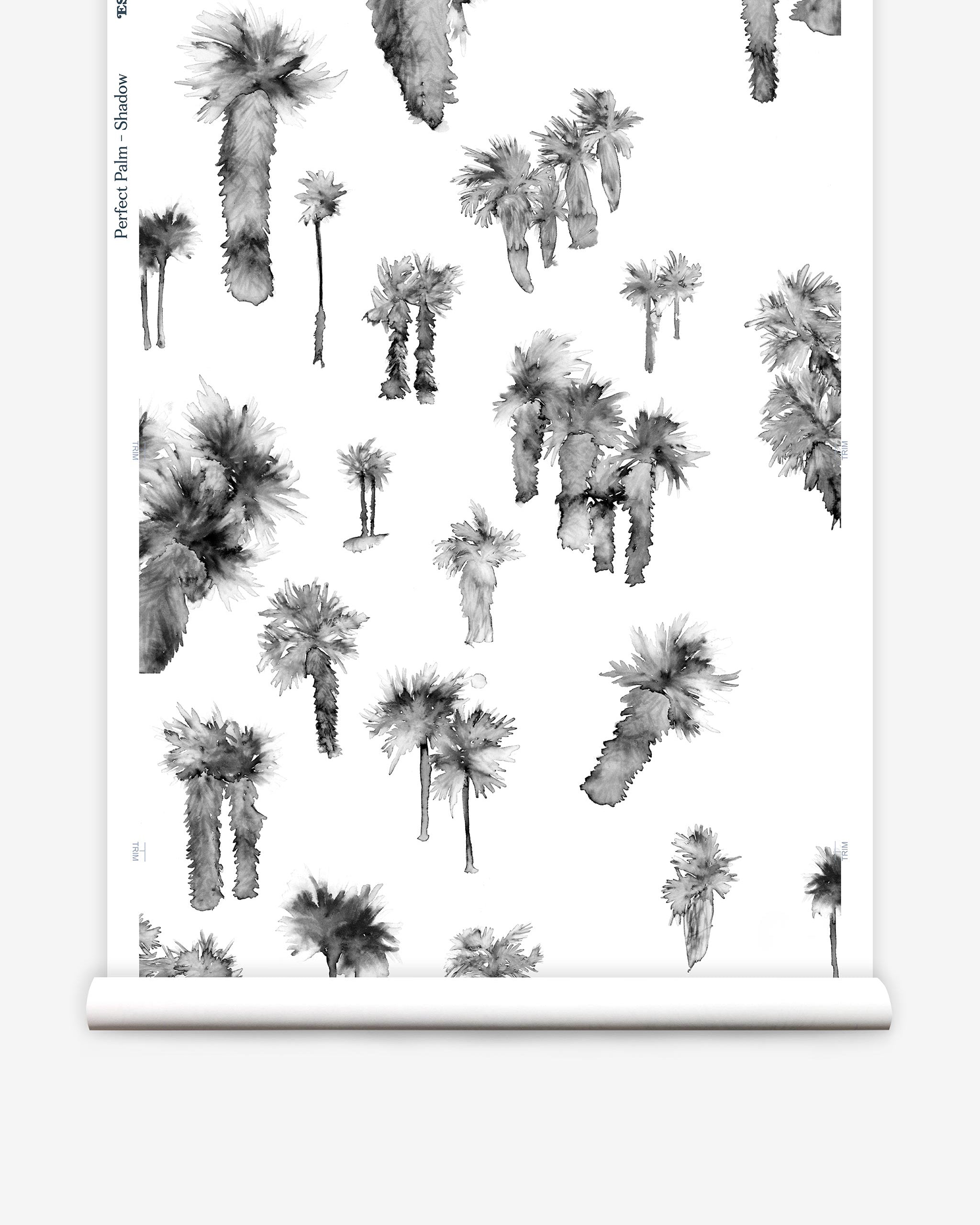 Partially unrolled wallpaper yardage in a playful palm tree print in shades of gray on a white field.