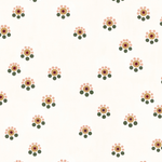 Detail of fabric in a minimal floral print in shades of pink, gold and green on a cream field.