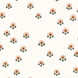 Detail of fabric in a minimal floral print in shades of pink, gold and green on a cream field.