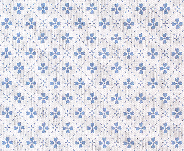 Detail of fabric in a dainty floral lattice print in blue on a white field.