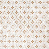 Detail of fabric in a dainty floral lattice print in tan on a cream field.