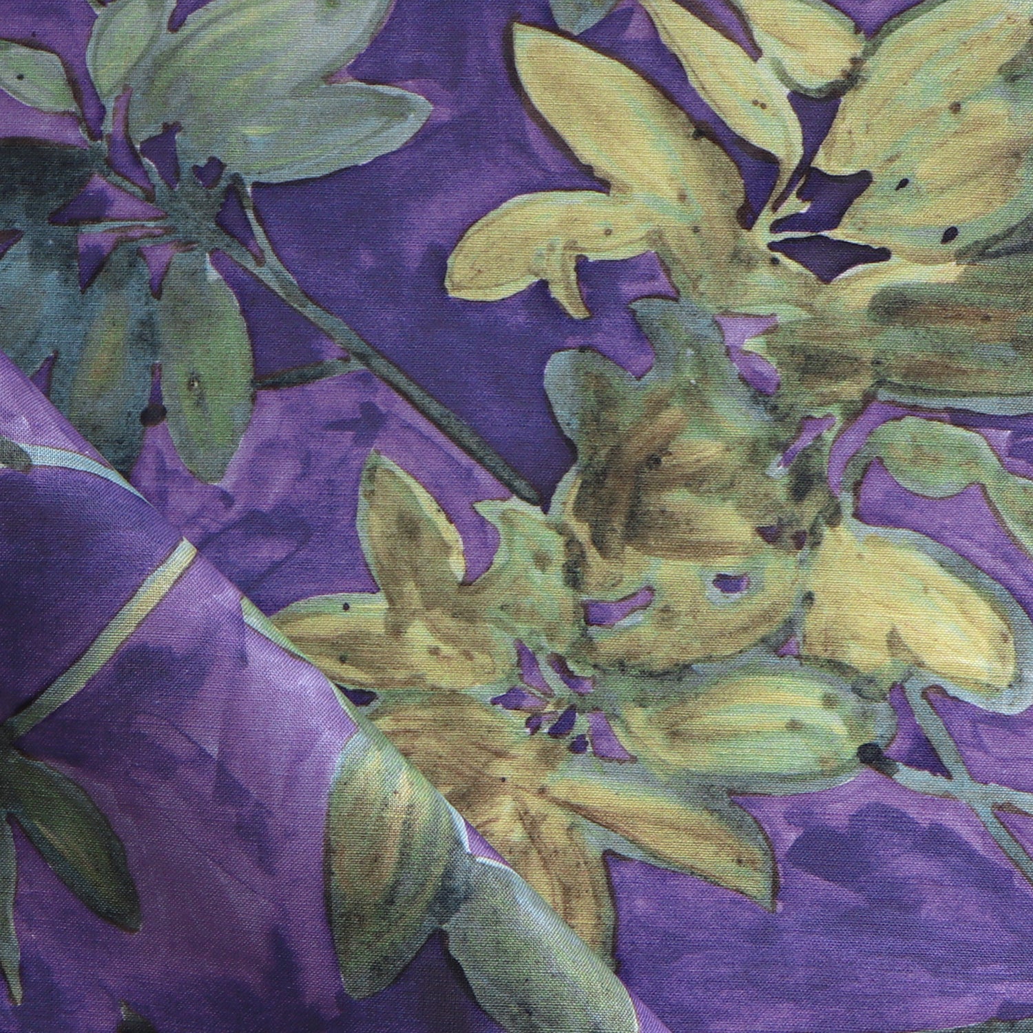 Fabric with floral pattern with green leaves on a purple background