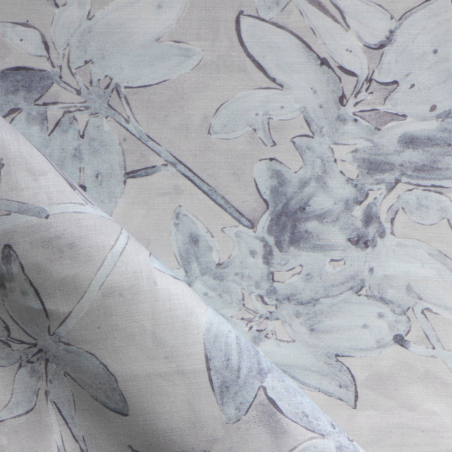 Close-up of floral patterned fabric with gray flowers on a beige background