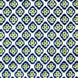 Detail of fabric in a floral lattice print in navy and green on a white field.