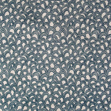 Detail of fabric in a playful repeating hoop pattern in navy on a tan field.