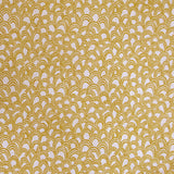 Detail of fabric in a playful repeating hoop pattern in mustard on a cream field.