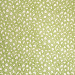 Detail of fabric in a playful repeating hoop pattern in light green on a cream field.