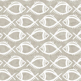 Detail of wallpaper in a playful fish print in white on a greige field.