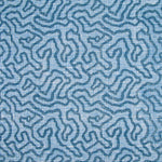 Printed fabric in a meandering hand drawn line pattern in blue on a light blue field.