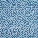 Printed fabric in a meandering hand drawn line pattern in blue on a light blue field.