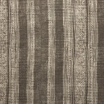 Woven fabric swatch in a striped pattern of intricate white lines over a washed charcoal background.