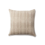 Handwoven pillow in a subtle geometric design in shades of brown and cream. 