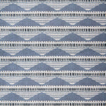 Swatch of linen fabric in a linear pattern with a sand dune-shaped triangle stripe motif in shades of navy, light blue and gray.