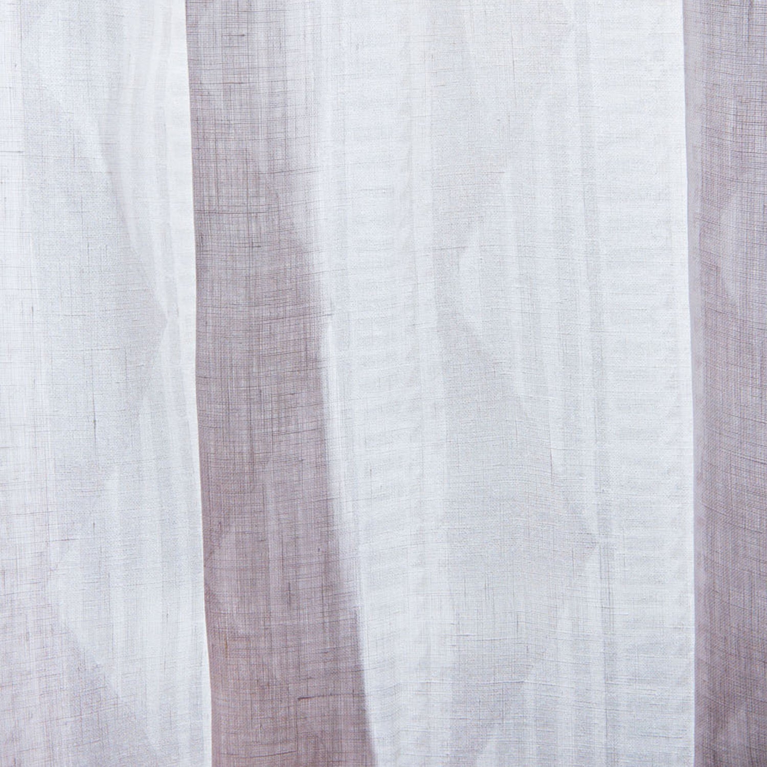 Close-up sheer linen fabric swatch in a horizontal stripe pattern broken with triangluar shapes, in shades of white.