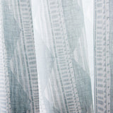 Close-up sheer linen fabric swatch in a horizontal stripe pattern broken with triangluar shapes, in shades of gray.