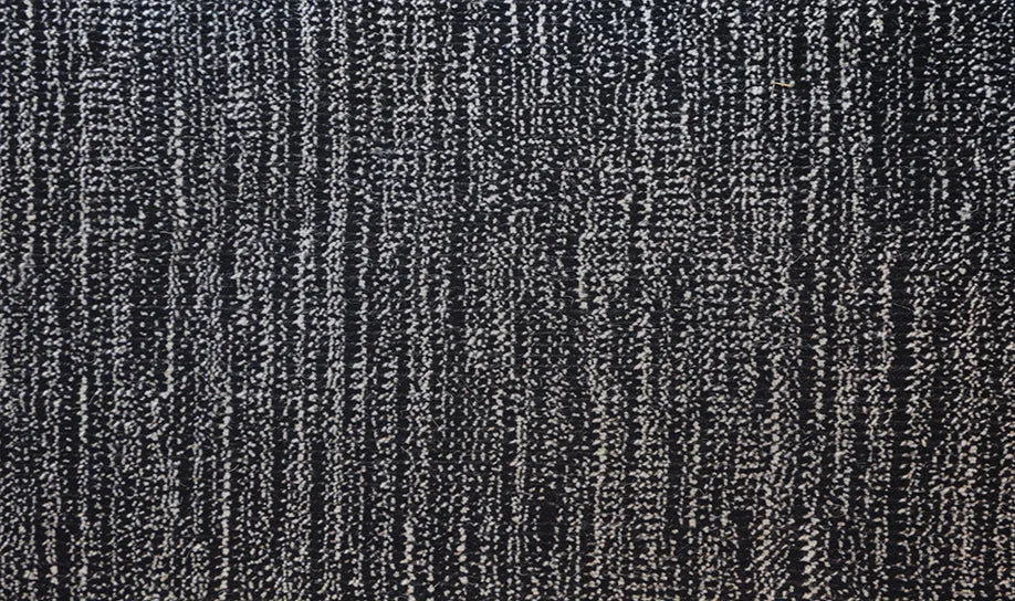 Broadloom carpet swatch in a textural pattern in a black design