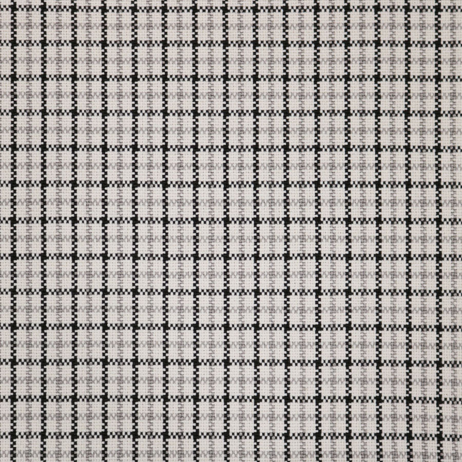 Broadloom carpet swatch in a checkered pattern in a white light grey black design