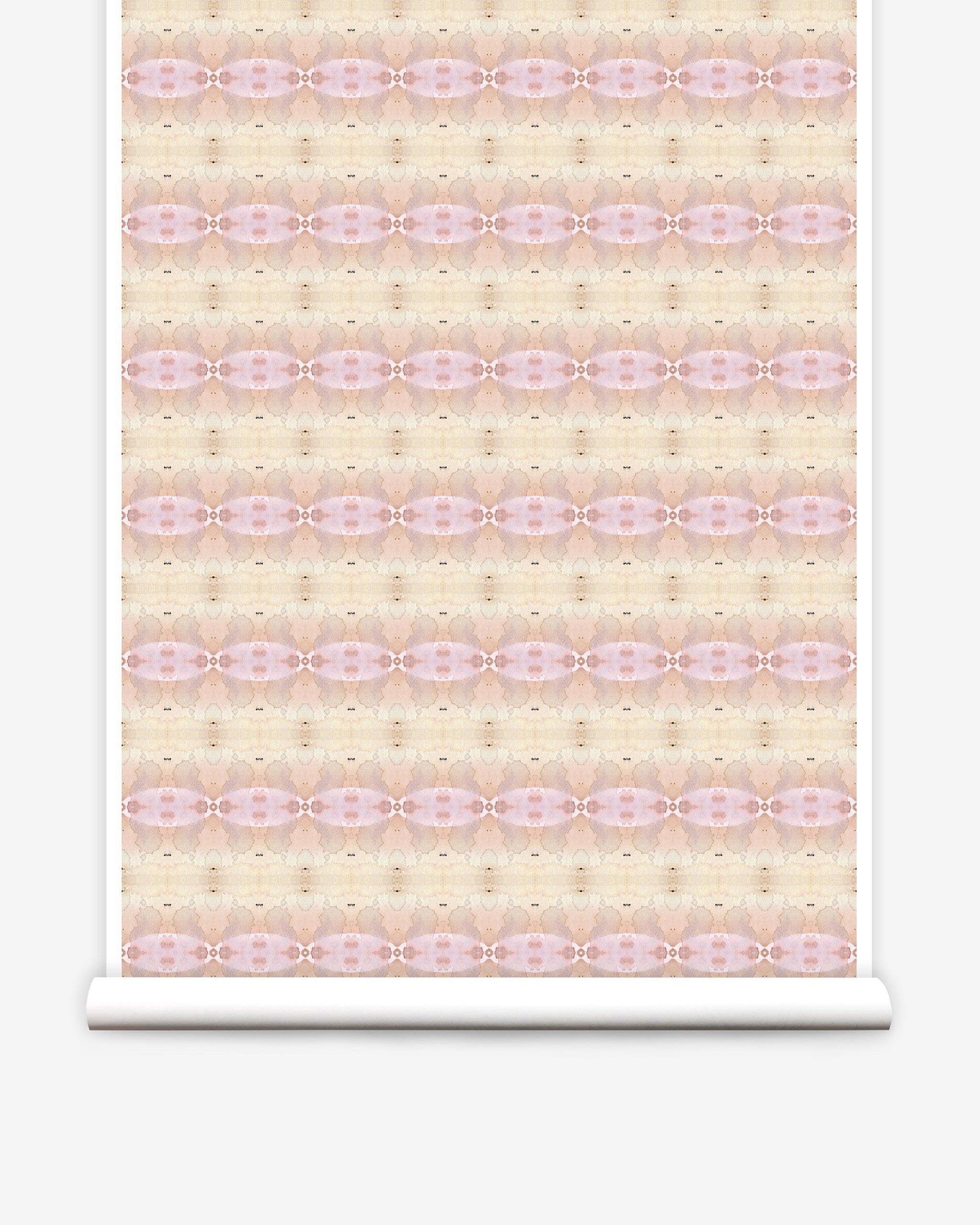 Partially unrolled wallpaper yardage in a gridded paint splatter print in shades of pink, yellow, cream and white.