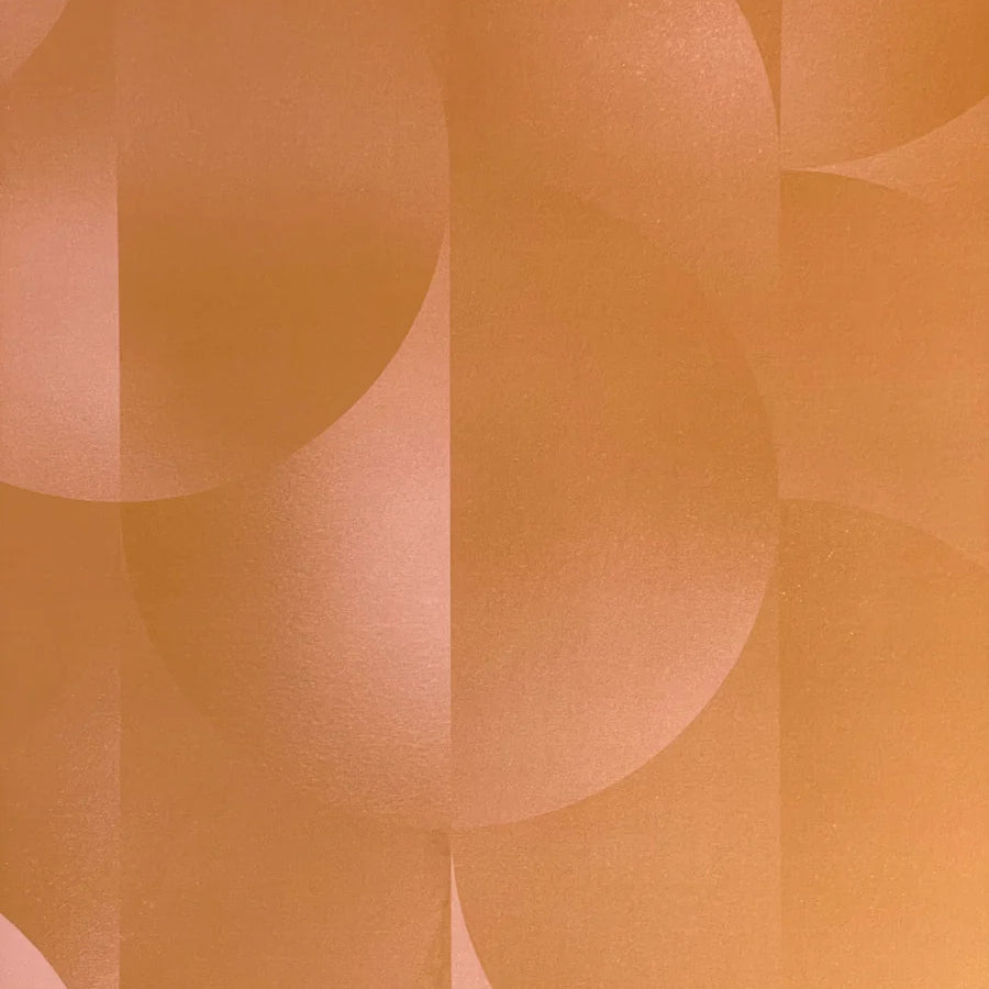 Detail of wallpaper in an abstract curvilinear print in mottled orange and pink.