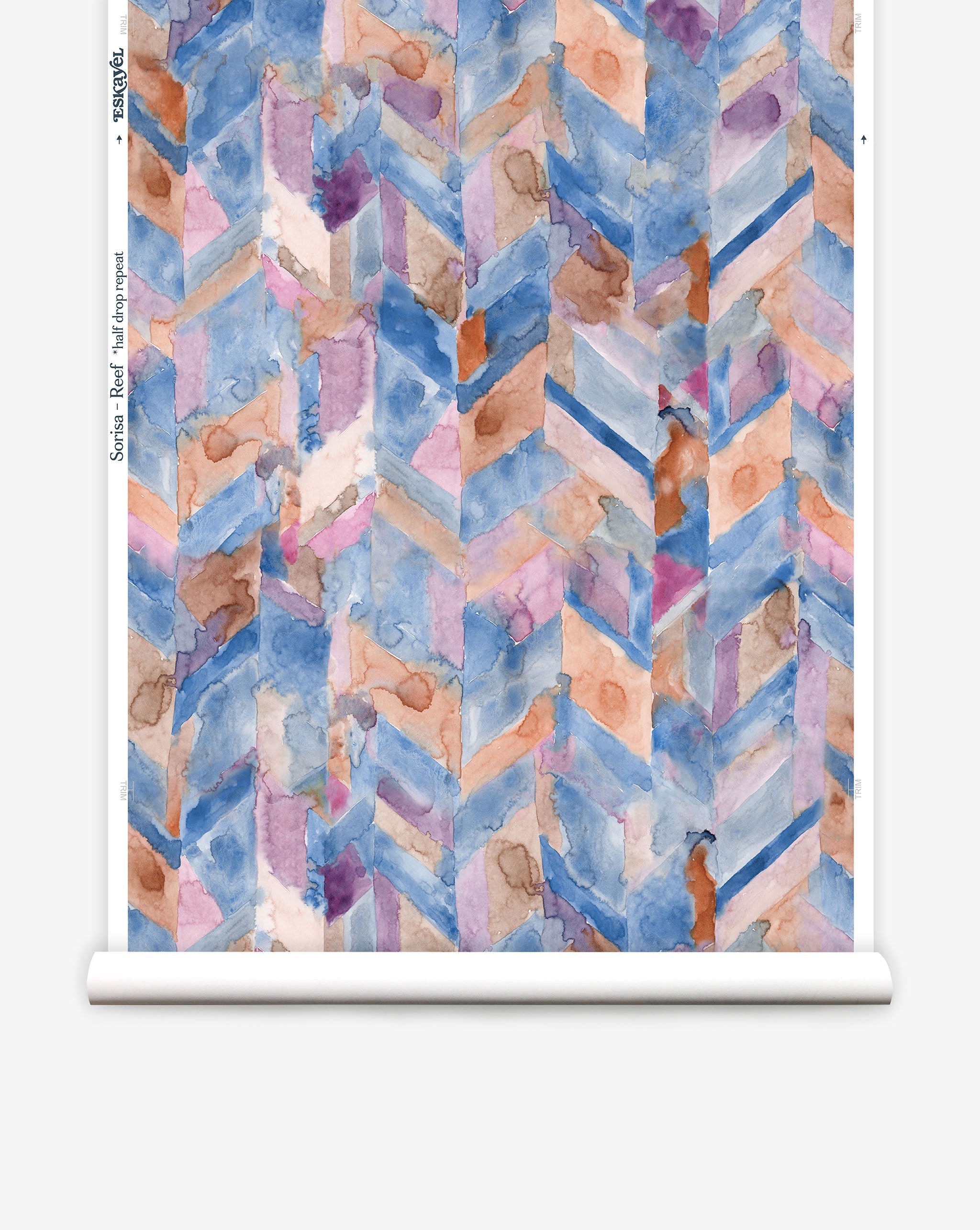 Partially unrolled wallpaper yardage in a painterly herringbone print in shades of blue, pink and orange.